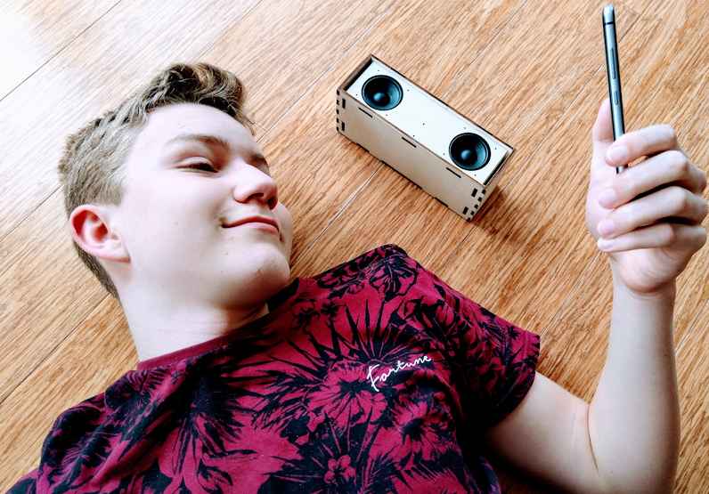 Teen lying next to DIY Bluetooth Speaker Forget making plastic gadgets, make something real with our DIY Speaker Kit.